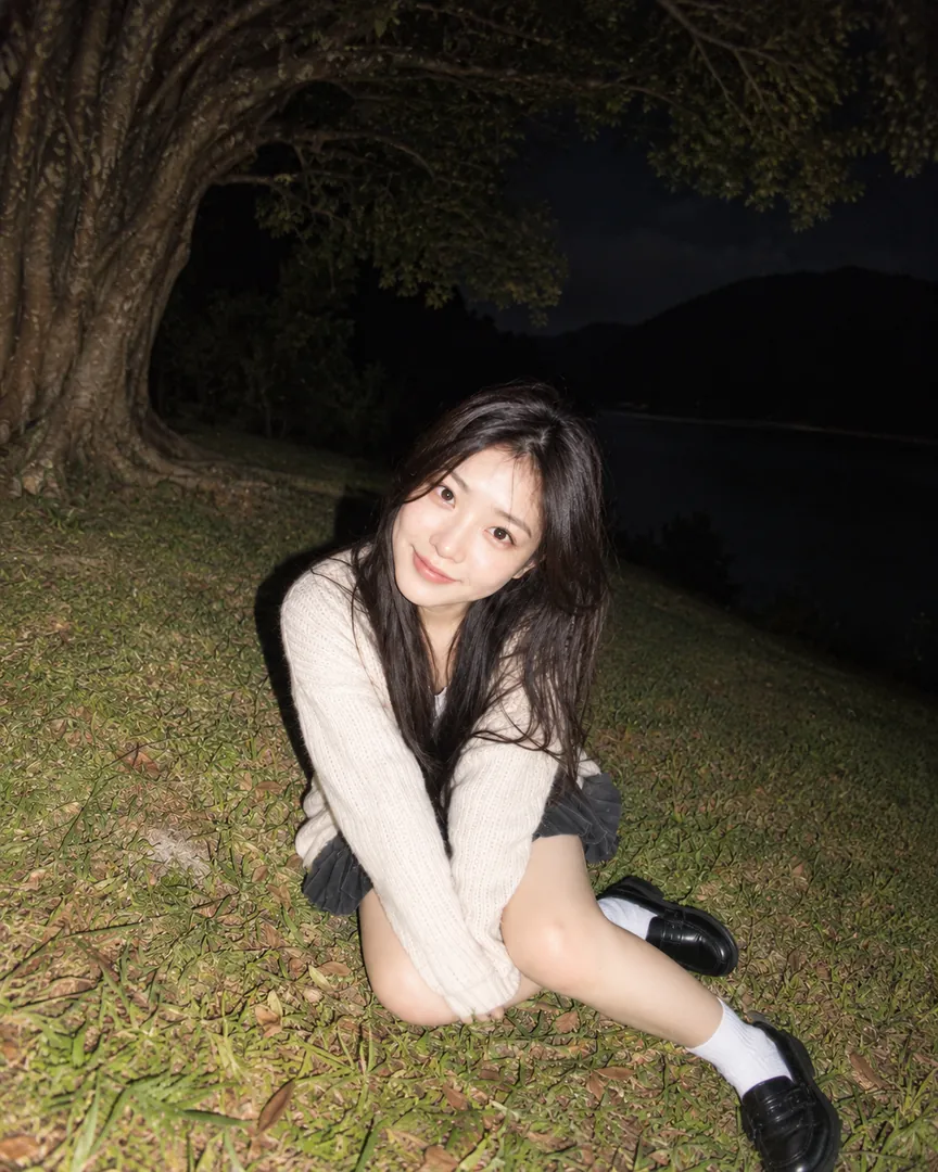 Night flash version: dark background, the person lit by a direct flash from the front
